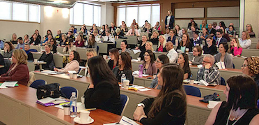 A lecture hall full of women