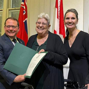Barb McPhee receiving the King Charles II Coronation Award