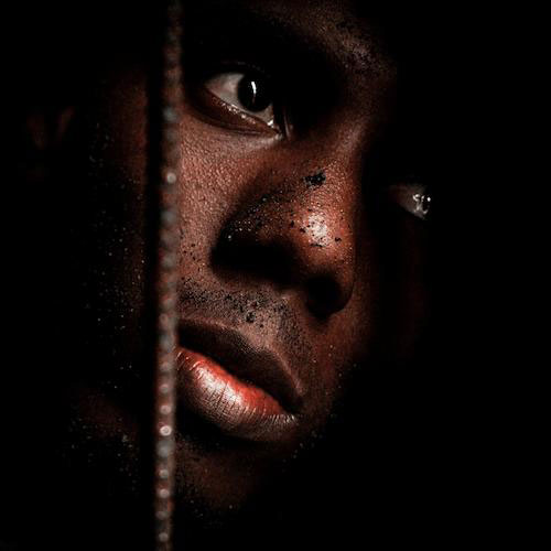 A close-up of a Black man's face